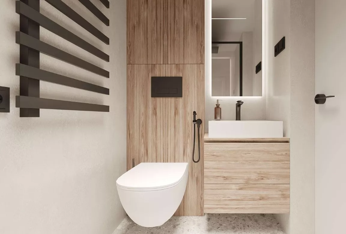Shower area of the  modular house with glass door and black accents