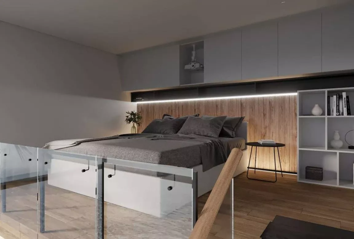 Loft bedroom in the  modular house with glass railing and projector setup